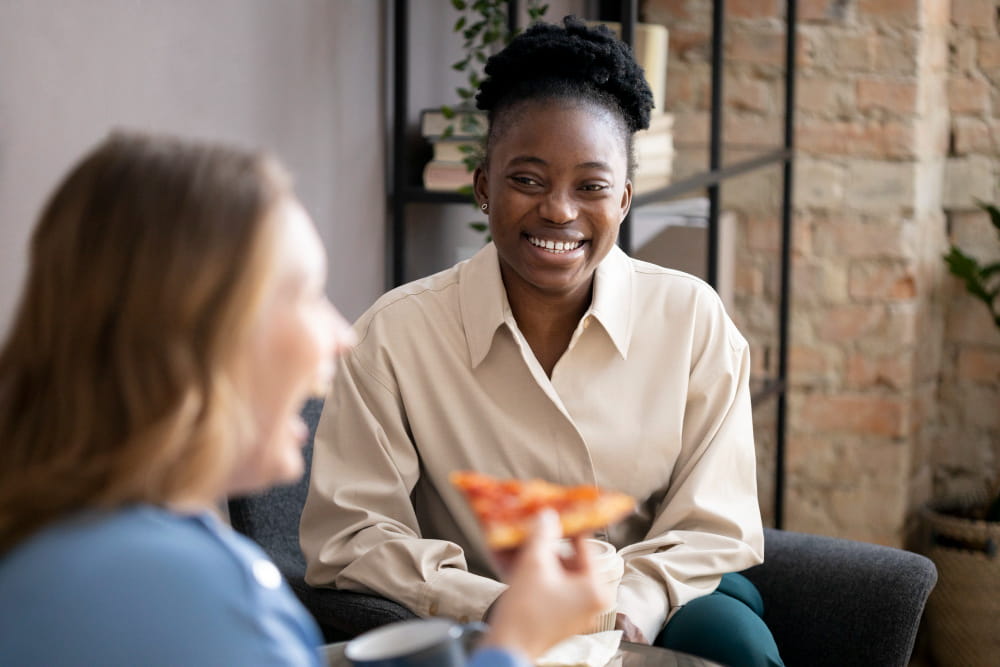 A care professional having a relaxed conversation at home